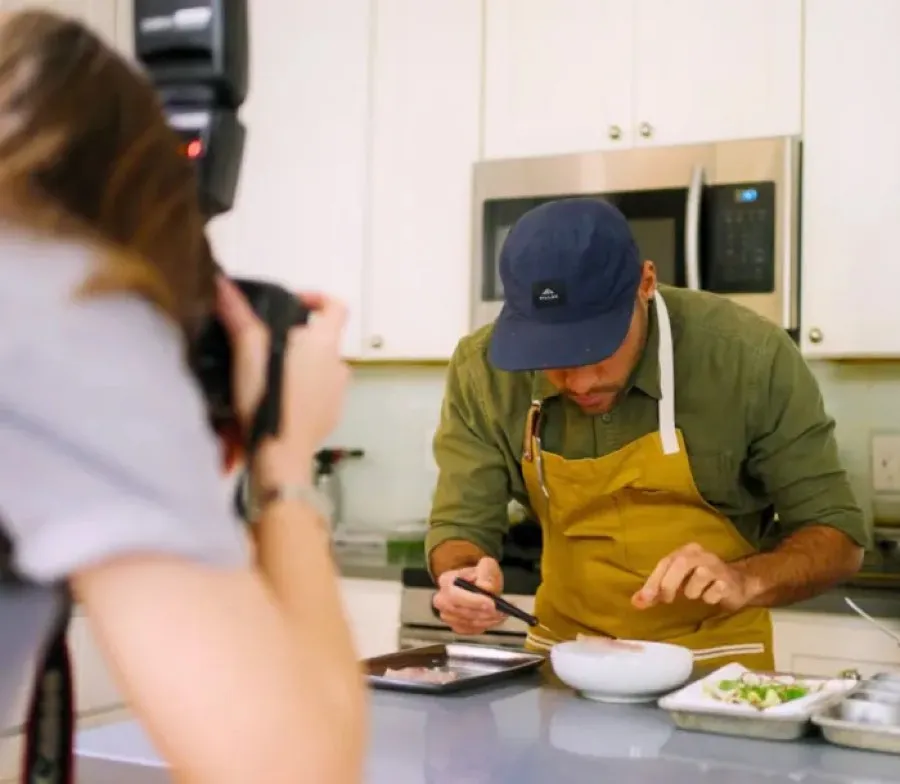 A Creator plating a dish during a shoot